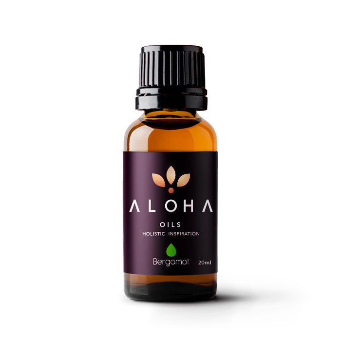 A 20ml amber glass bottle of Aloha Oils Bergamot essential oil with a sleek black cap and a modern purple label featuring the Aloha Oils logo and the tagline 'Holistic Inspiration.'