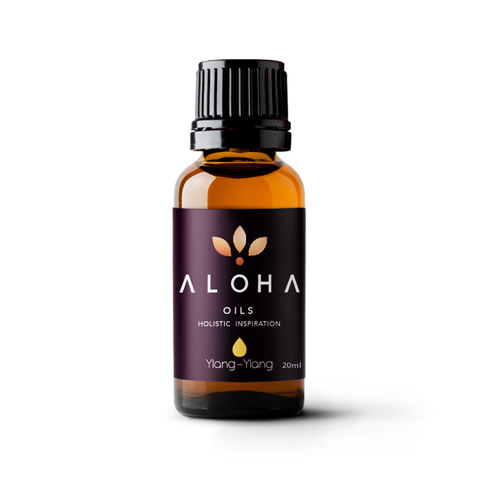 A 20ml amber glass bottle of Aloha Oils Ylang-Ylang essential oil with a sleek black cap and a modern purple label featuring the Aloha Oils logo and the tagline 'Holistic Inspiration.'